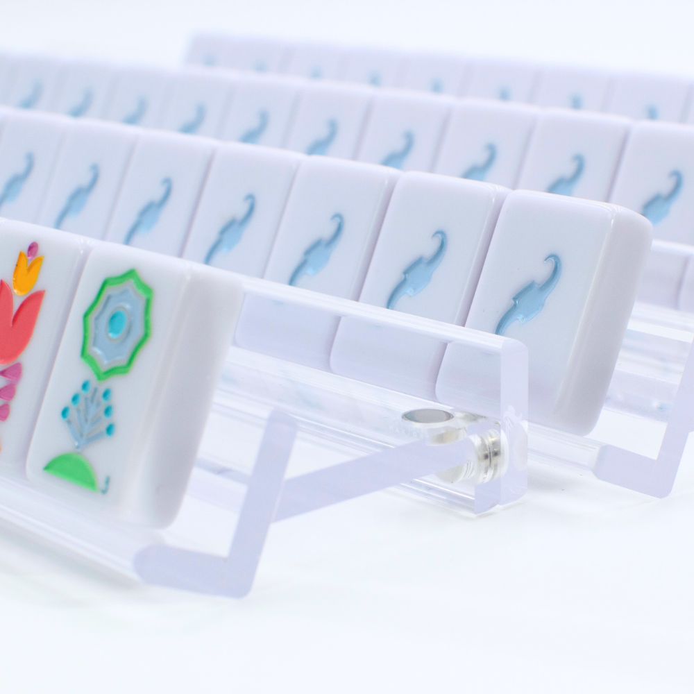 Set of clear plastic cards with colorful designs on a white background