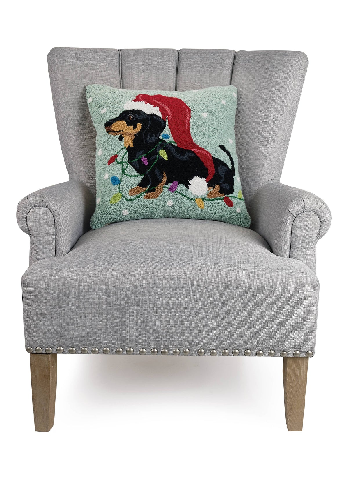 Hooked wool pillow of a dachshund in a long Christmas hat, alternate view 2
