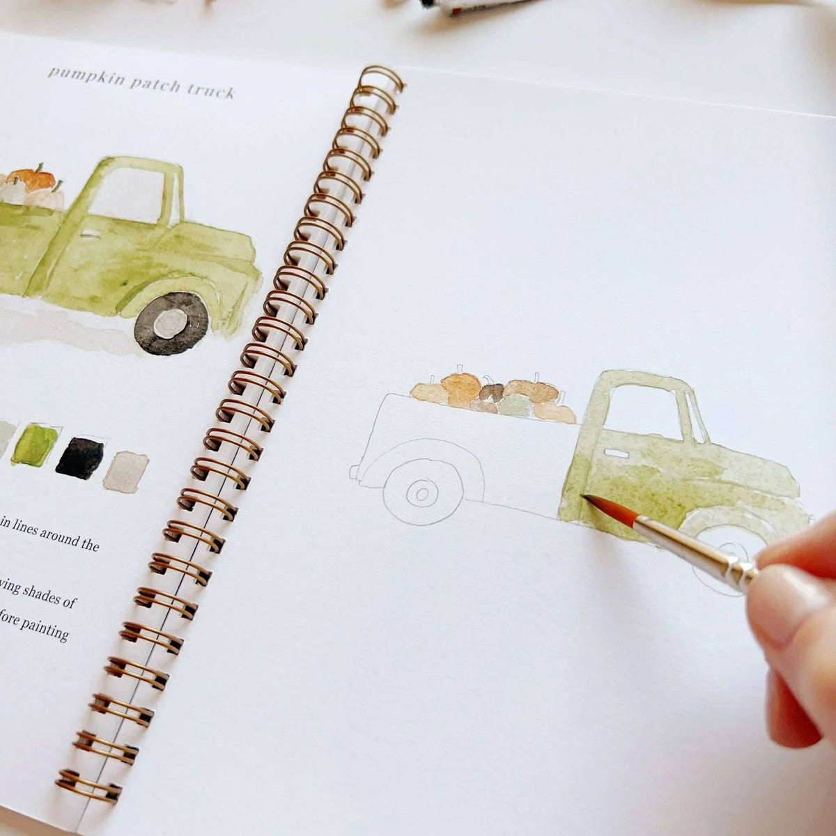 Green truck painting in progress in the autumn workbook