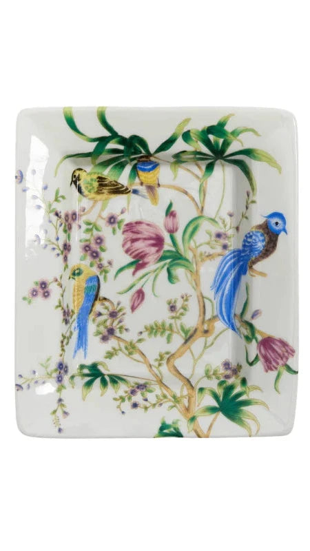 Decorative square plate with bird and floral design on a white background