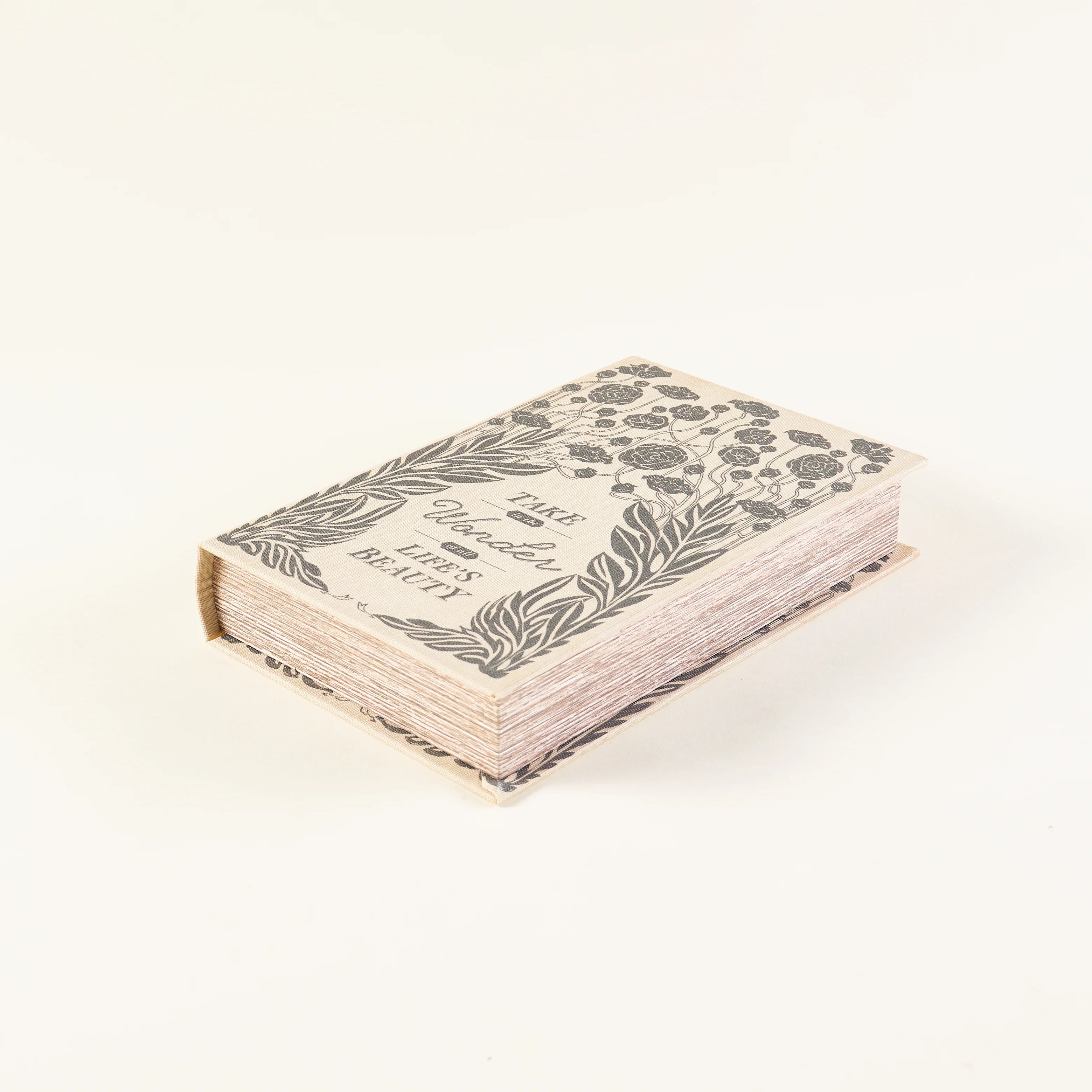 Small book with floral design on a white background