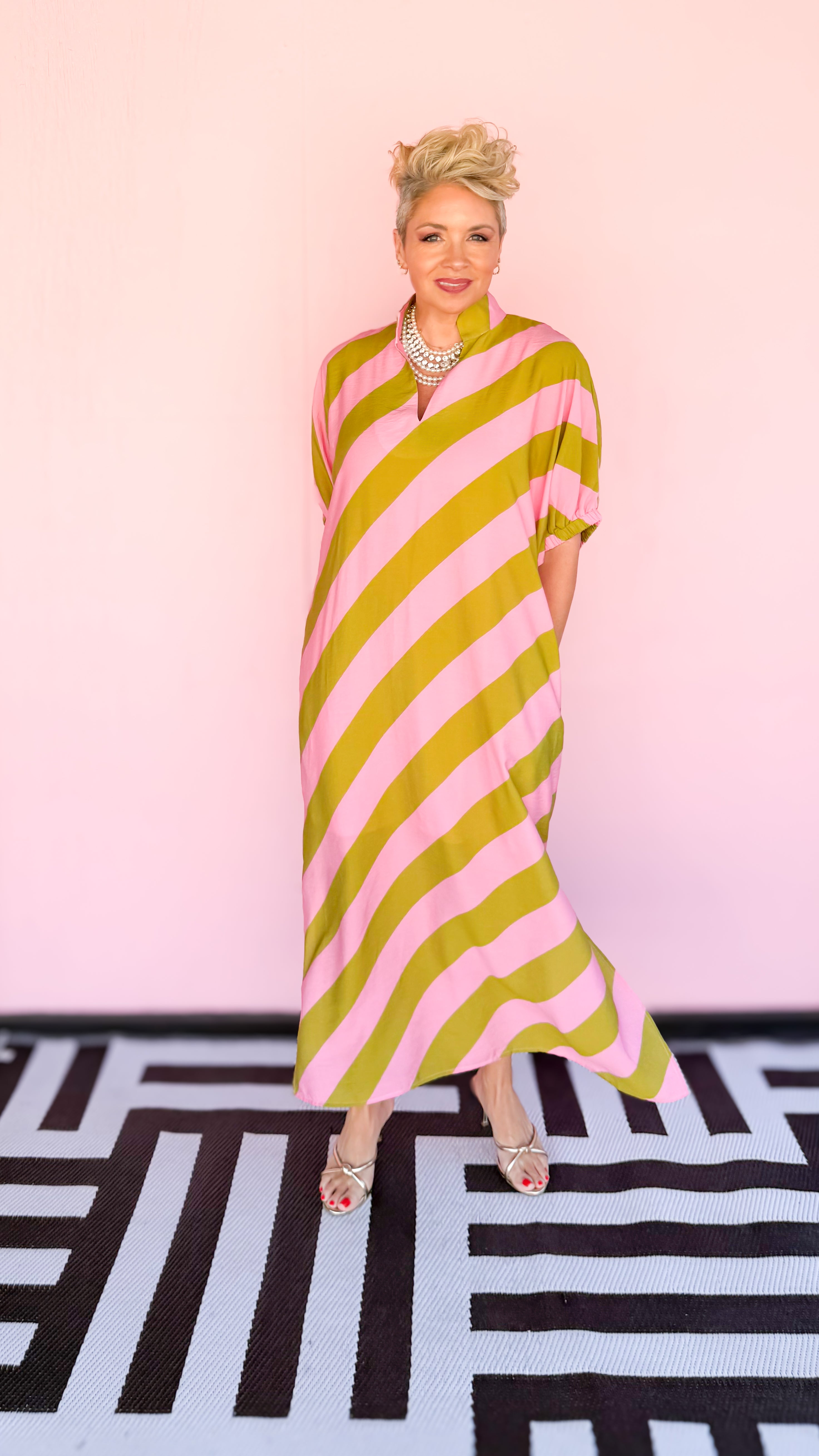 Kim diagonal stripe midi dress in pink and kiwi worn on model - detail view - BLVD Boutik