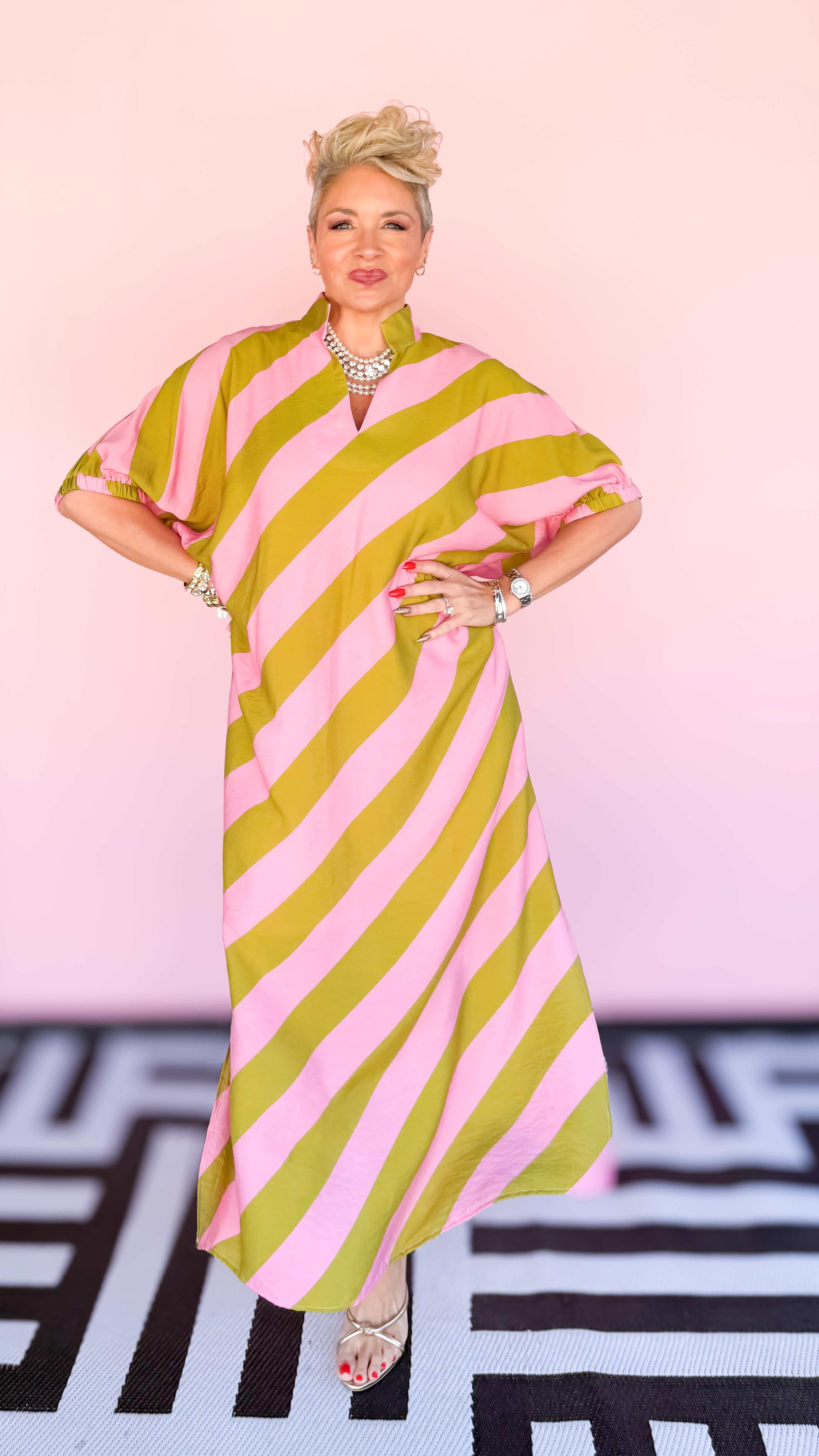 Kim diagonal stripe midi dress in pink and kiwi worn on model - side view - BLVD Boutik