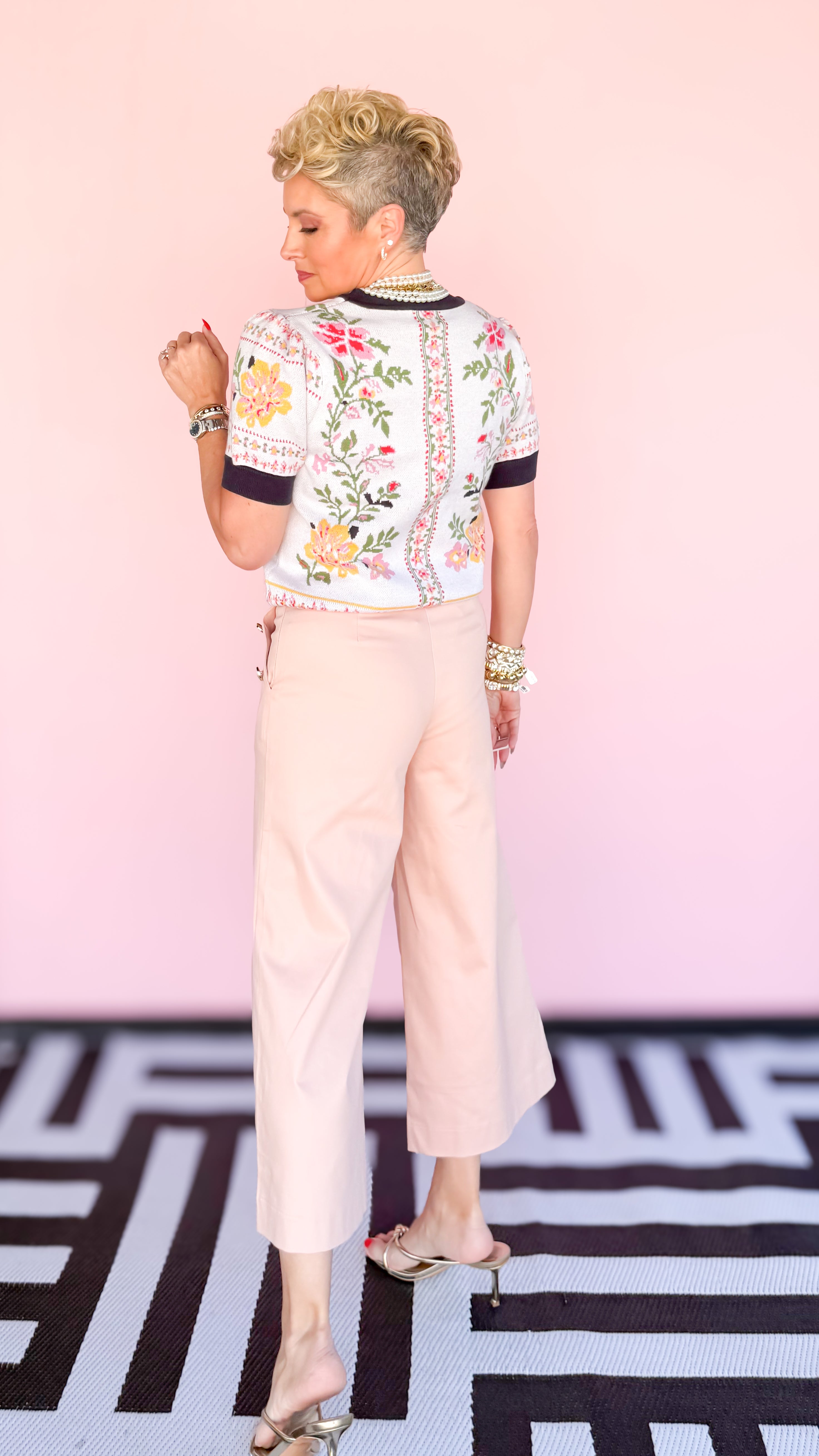 Cropped wide leg pants with gold buttons in blush worn on model - side view - BLVD Boutik