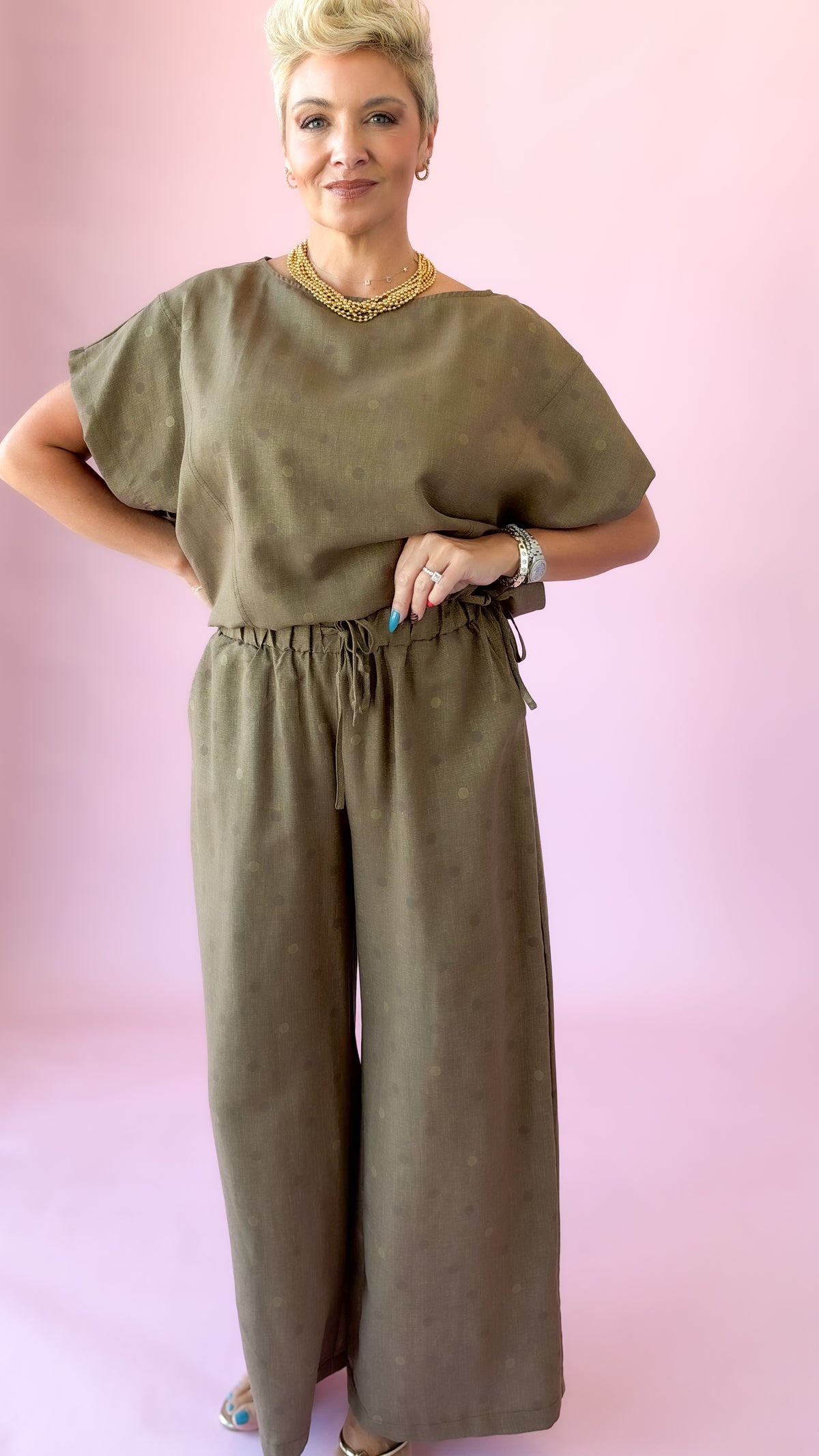 Full-length view of brown wide-leg polka dot pants set