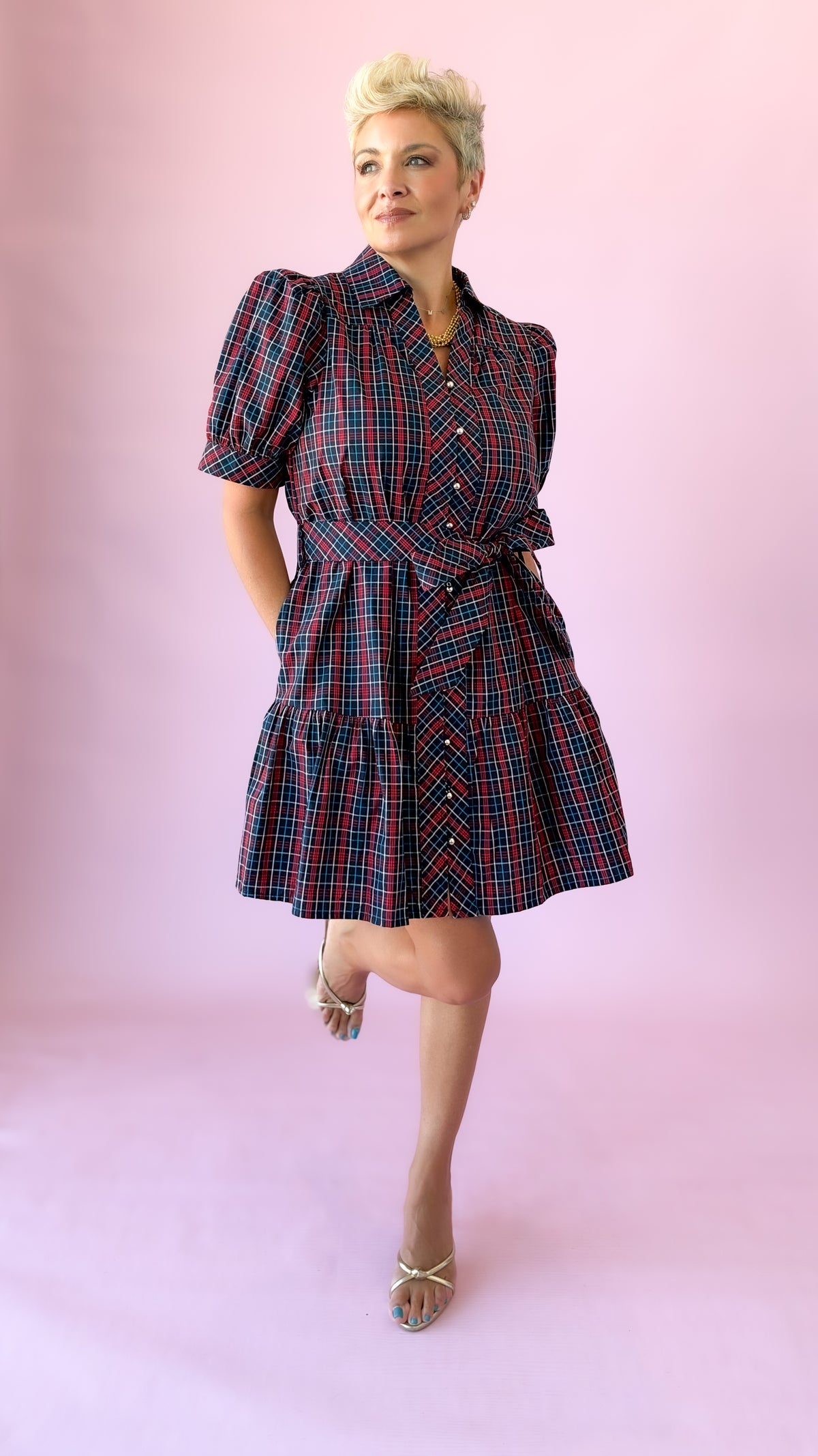 Full-length view of navy plaid Angelica shirt dress with tie belt and tiered skirt