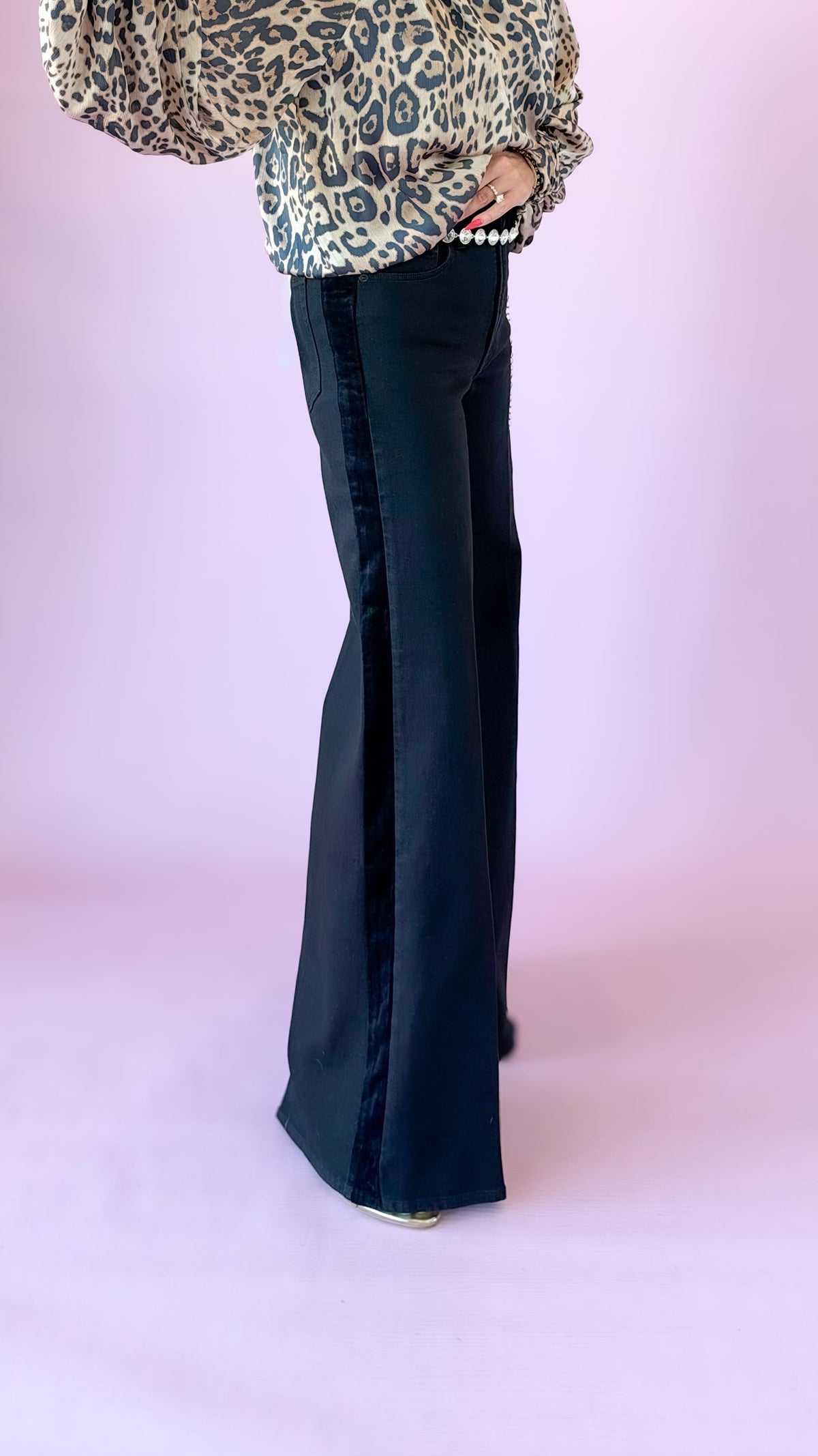 Black wide-leg palazzo jeans with velvet side stripe, styled with a leopard blouse
