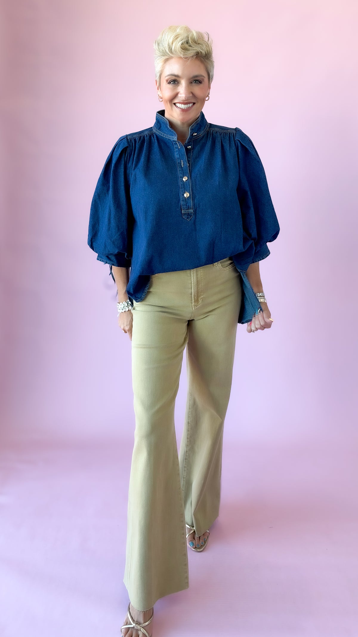 Full-length view of dark denim Ingrid puff sleeve top with khaki flare pants