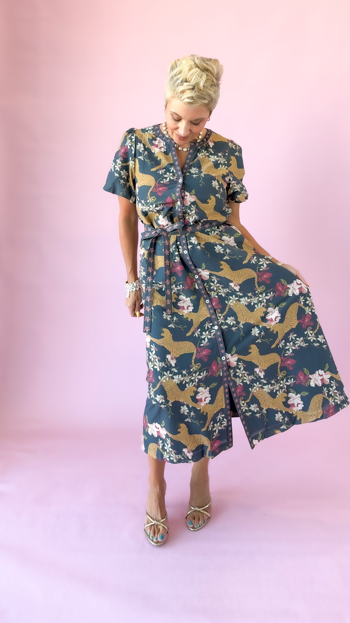Navy leopard print midi dress with skirt held out to show the full silhouette