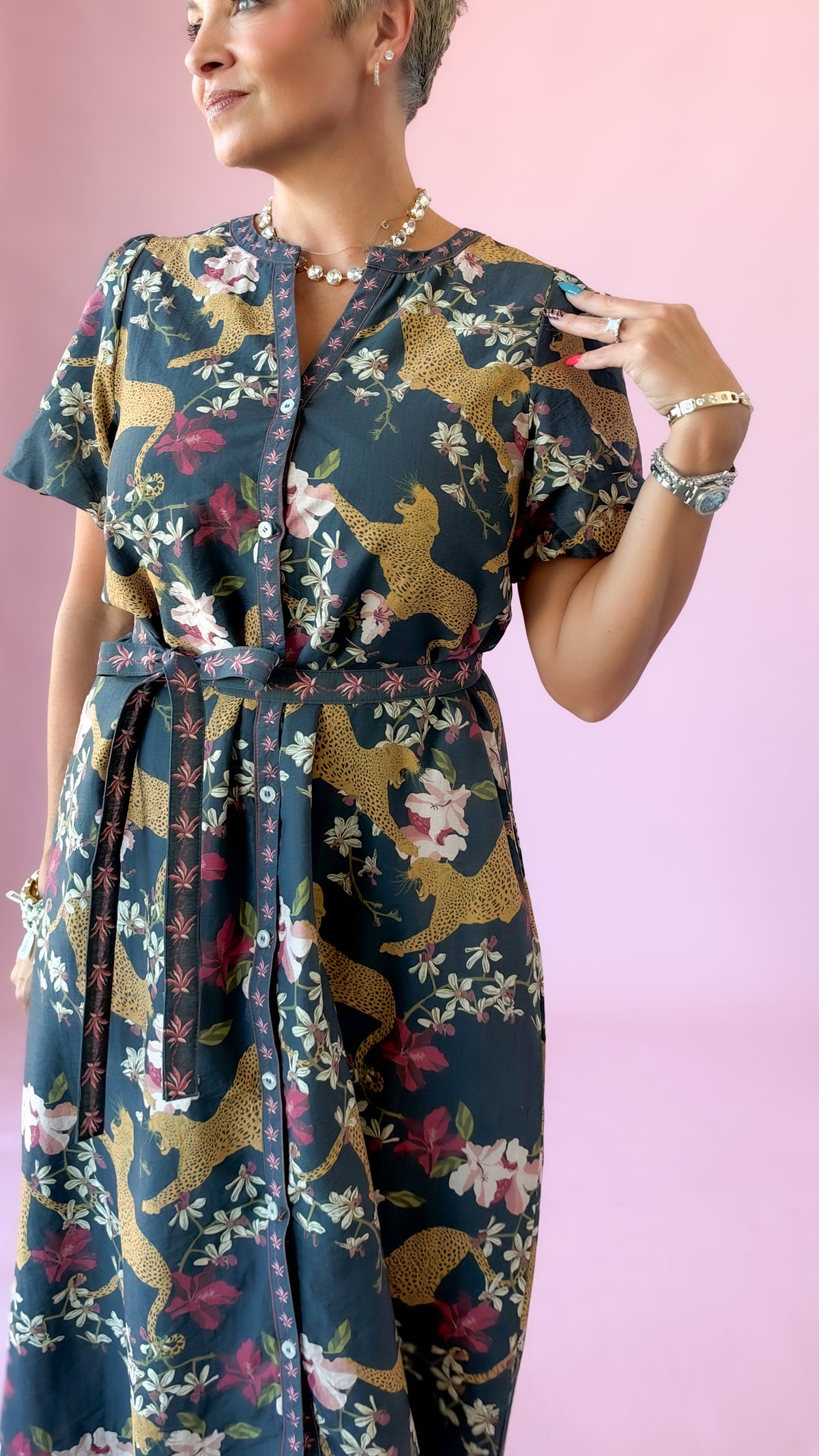Close-up of navy belted midi dress with leopard and floral print