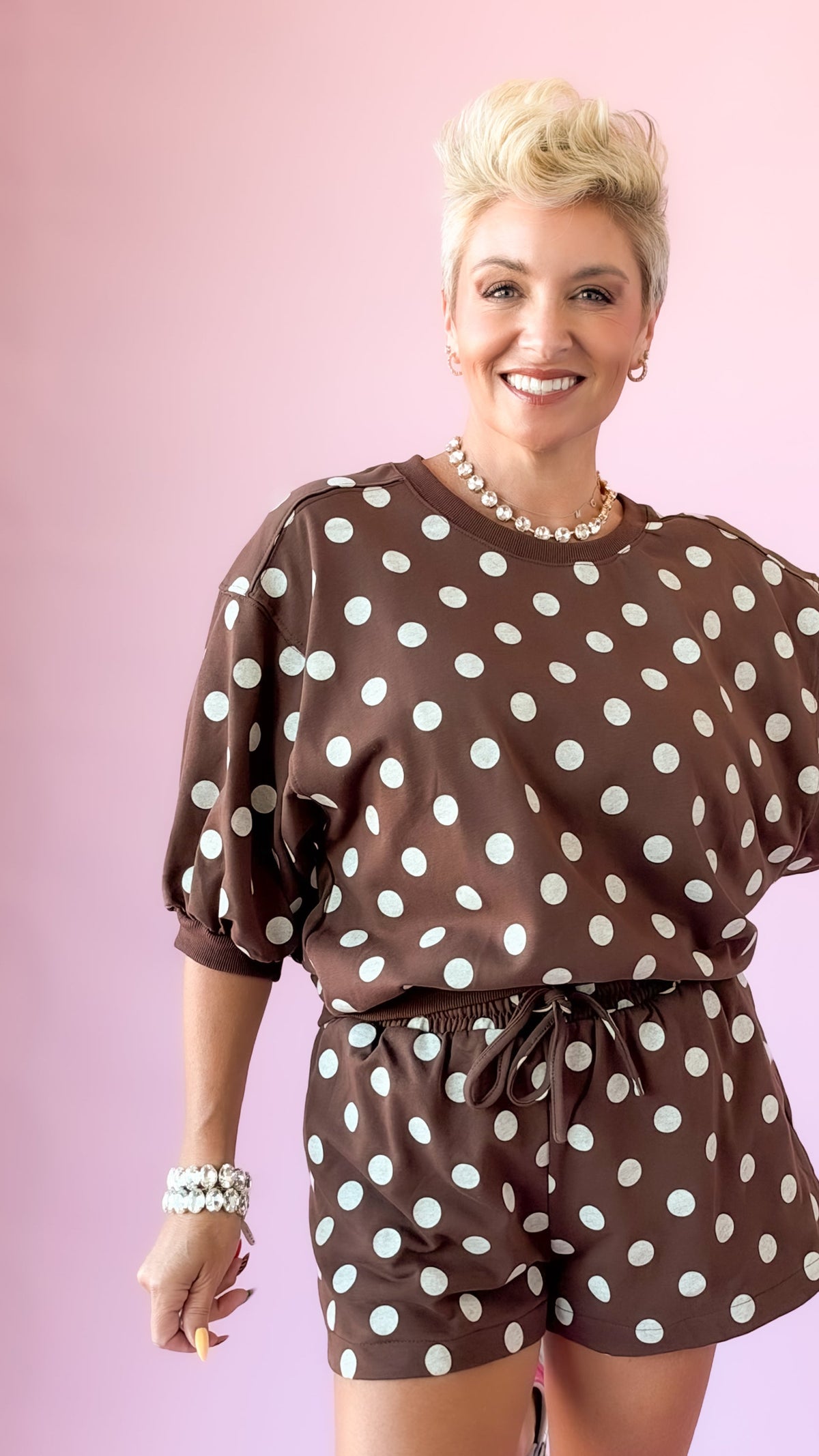 Close-up of brown polka dot lounge top with three-quarter puff sleeves