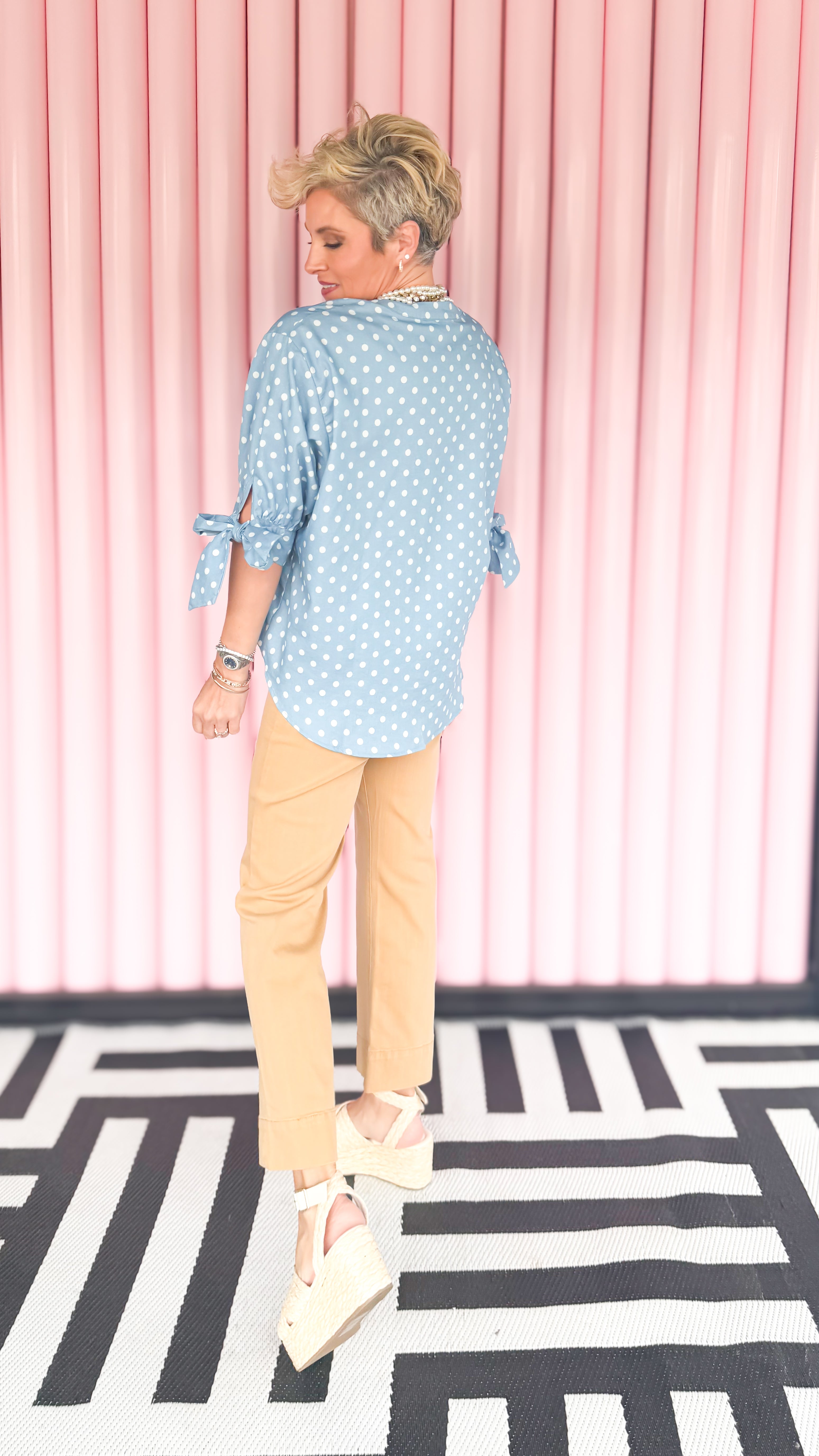 Polka dot bow sleeve blouse worn on model - styled view - BLVD Boutik