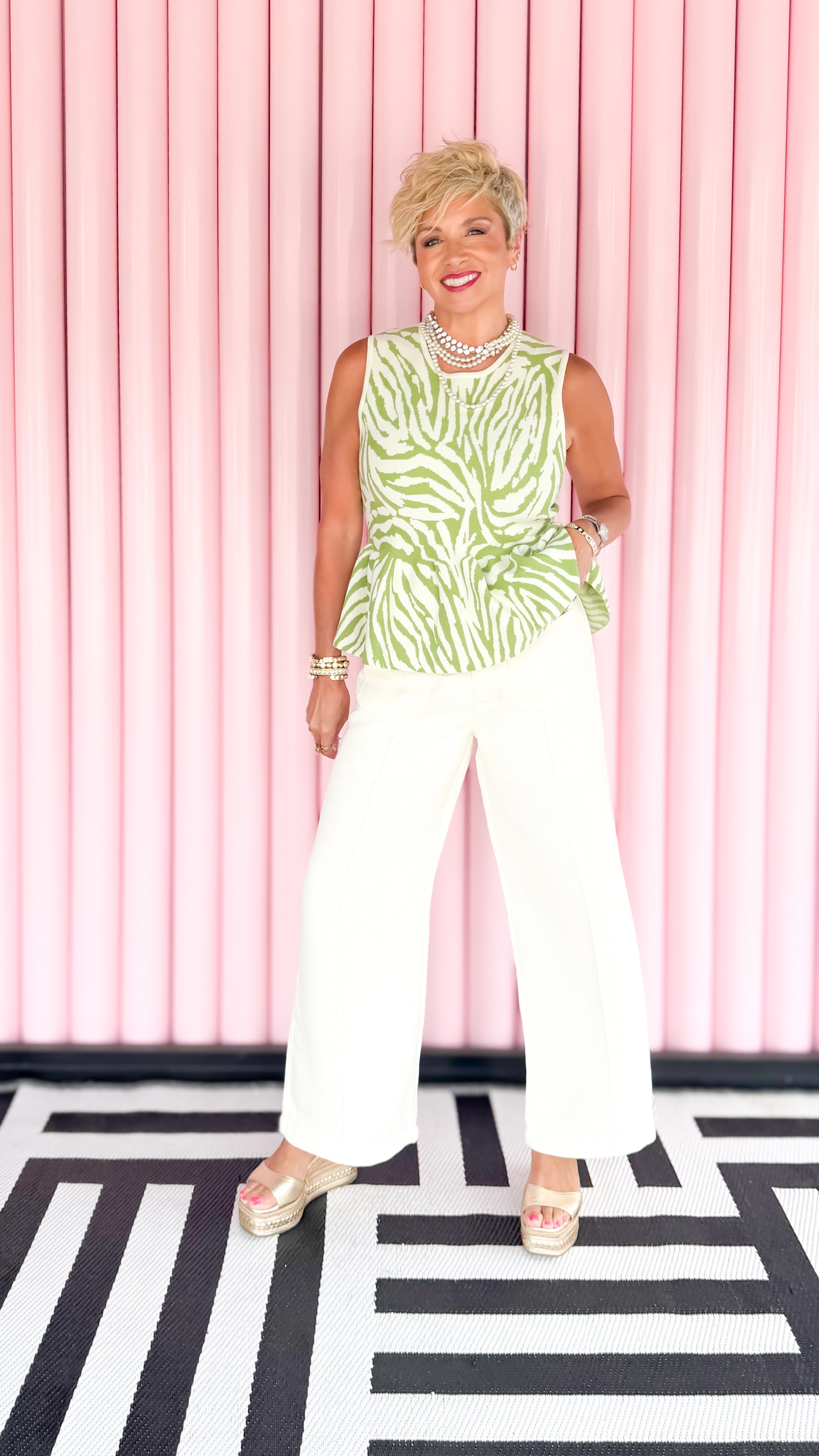 Zeta Zebra peplum top in green worn on model - detail view - BLVD Boutik