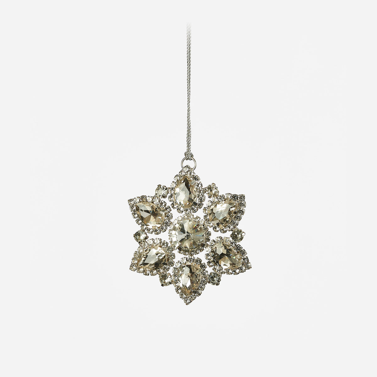 Silver metal snowflake ornament with faceted jewel accents, full view