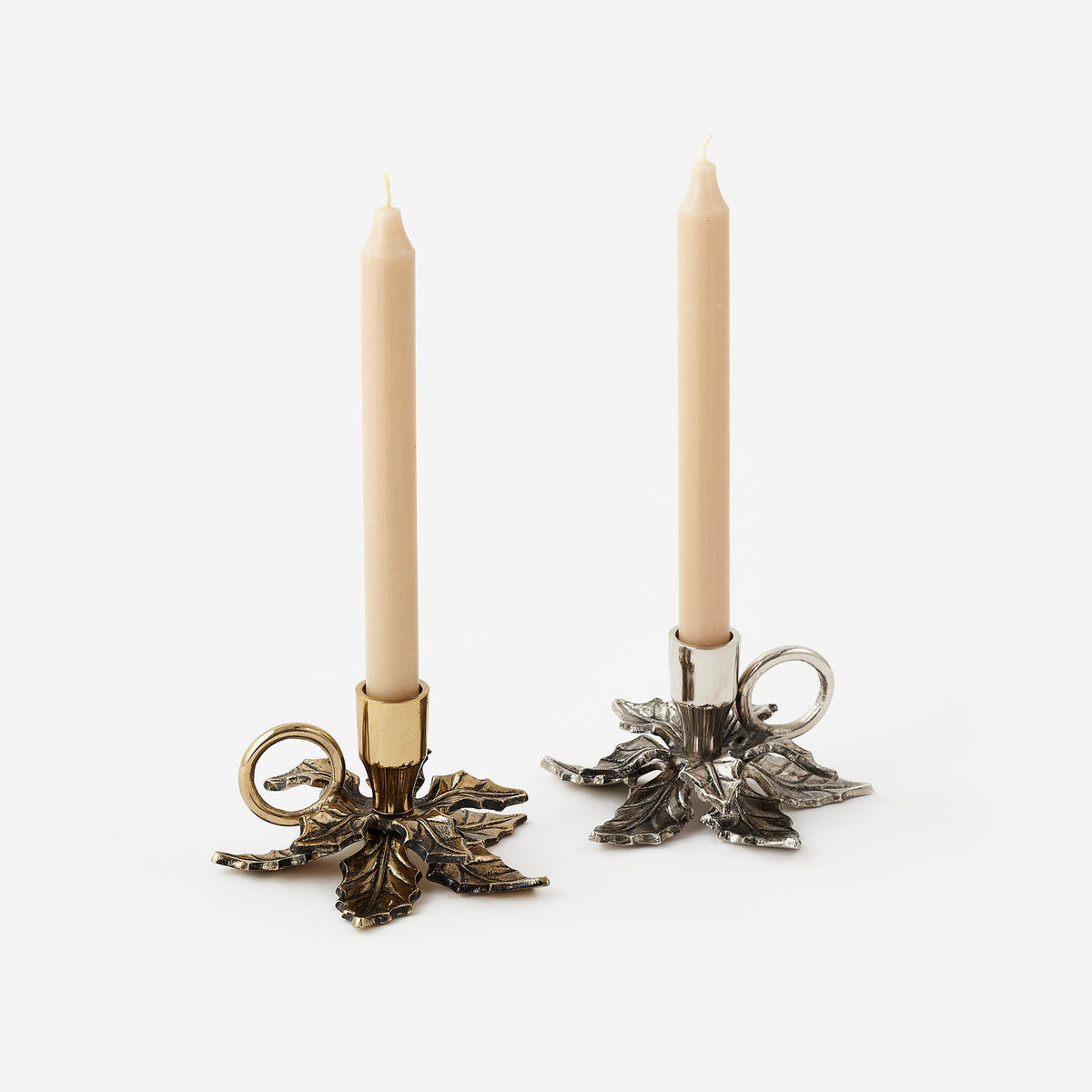Gold and silver metal chamberstick candle holders with holly detail, full view