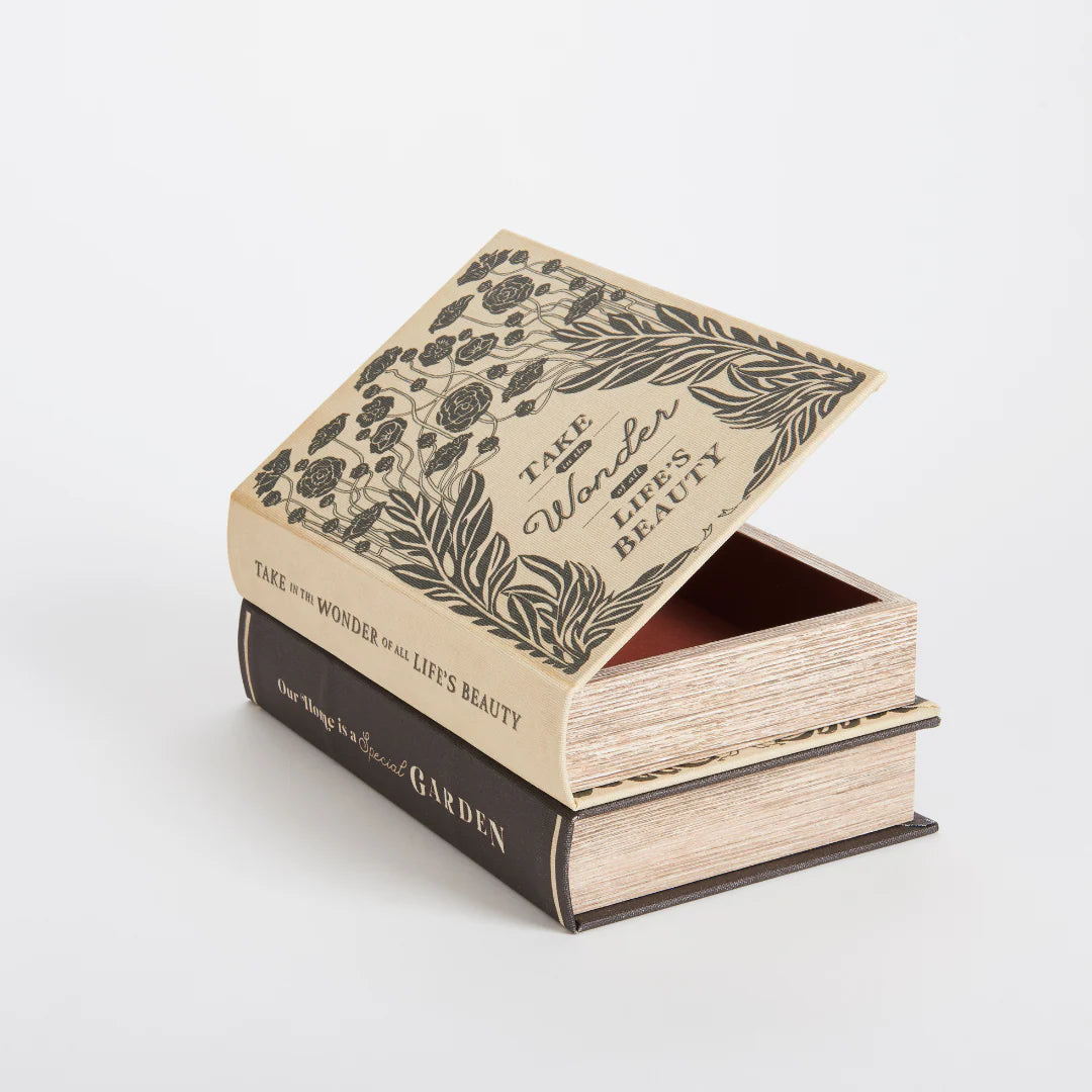 Book-shaped box with decorative cover on a white background