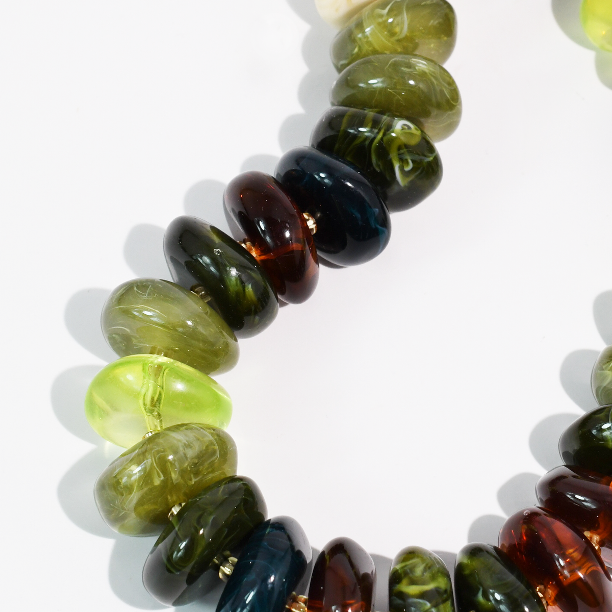 The Icon Necklace olive and amber bead detail