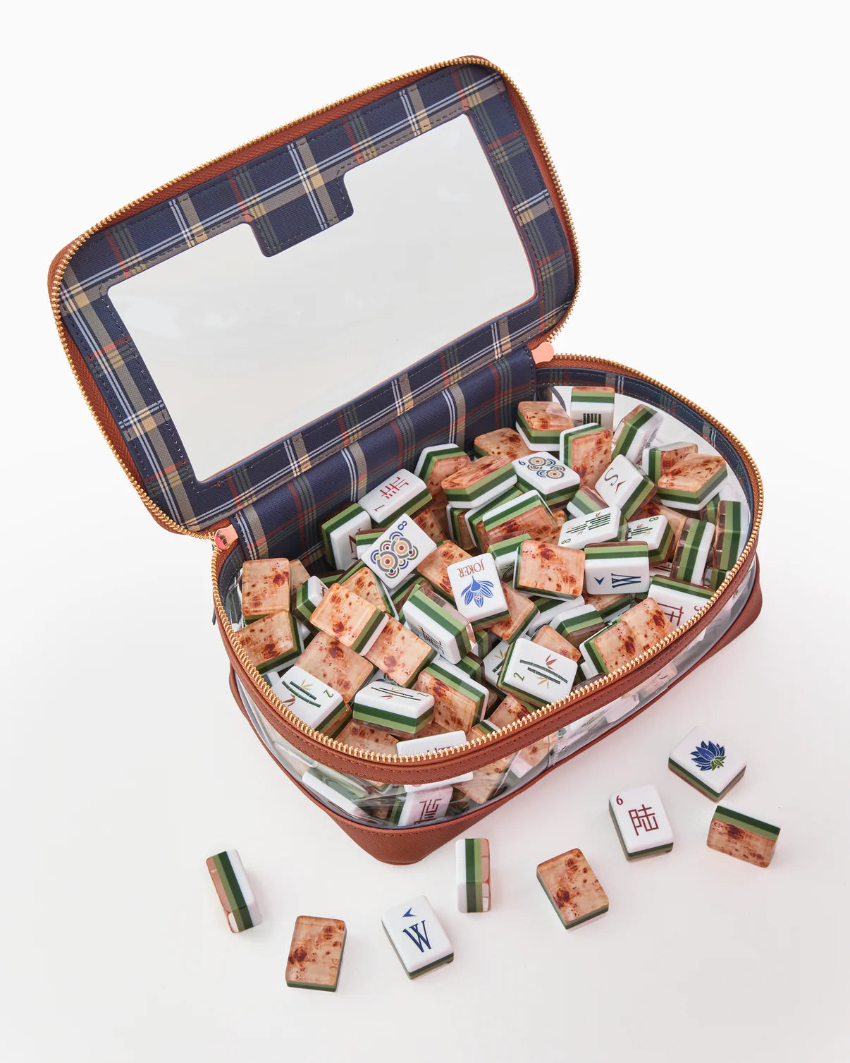 Open case with miniature decorative items on a white background