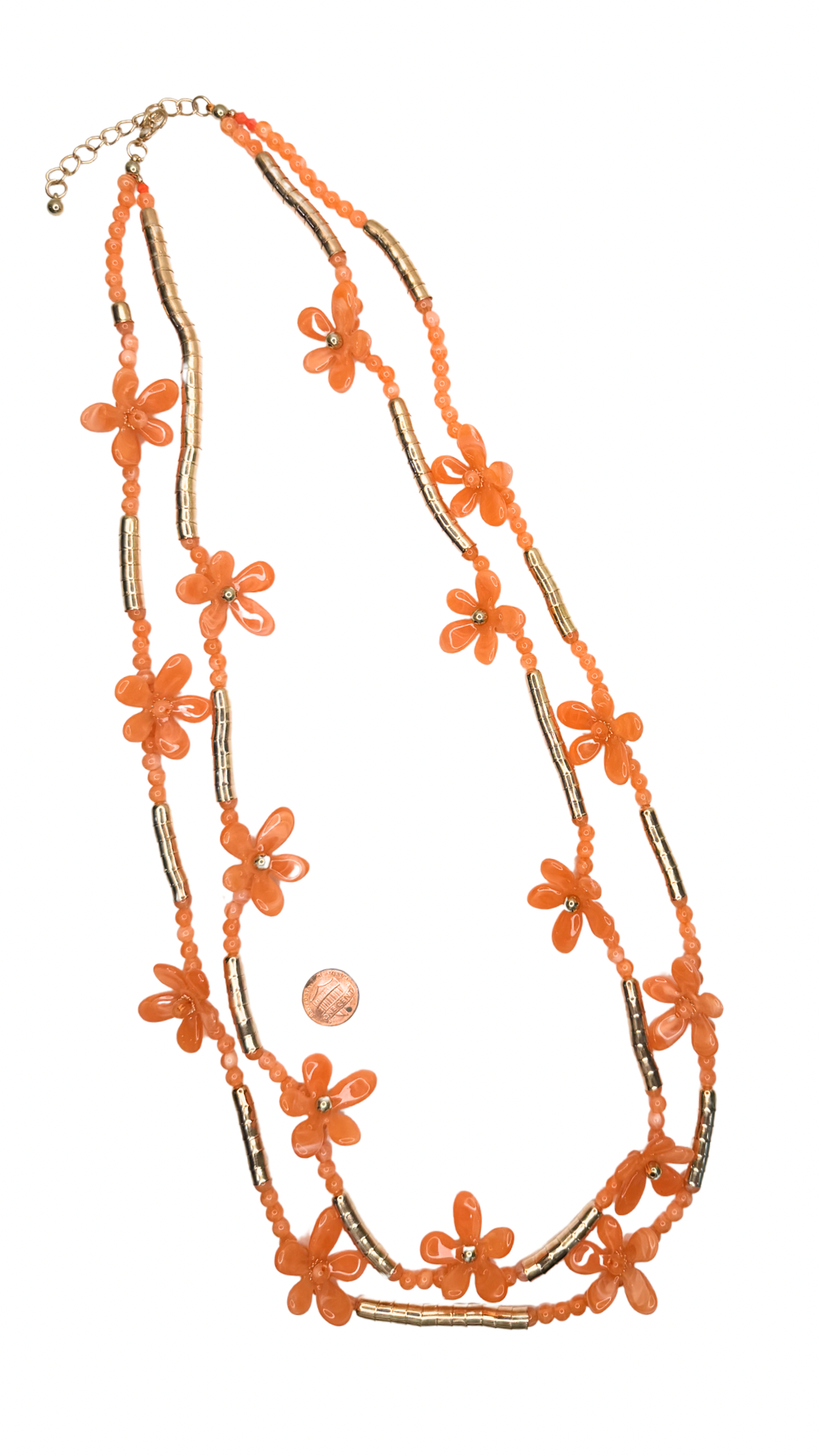 Necklace with orange floral beads on a white background