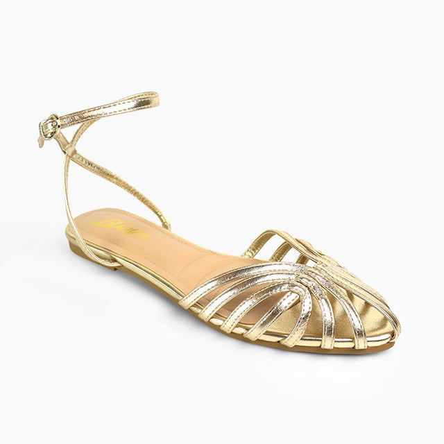 A single metallic gold flat sandal with a pointed toe, multiple thin crisscrossing straps, and a thin ankle strap, shown on a plain white background.