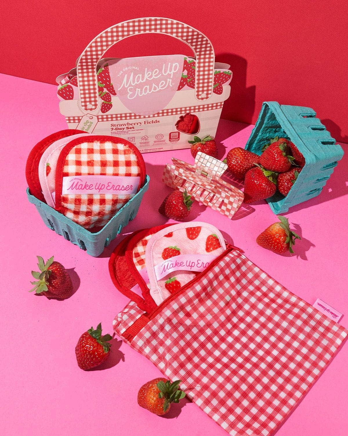 Makeup eraser set with strawberry design and checkered pattern on a pink background