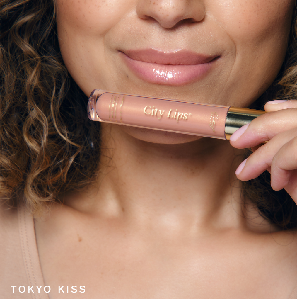 City Lips plumping lip gloss in Tokyo Kiss, a sheer cool-nude shade