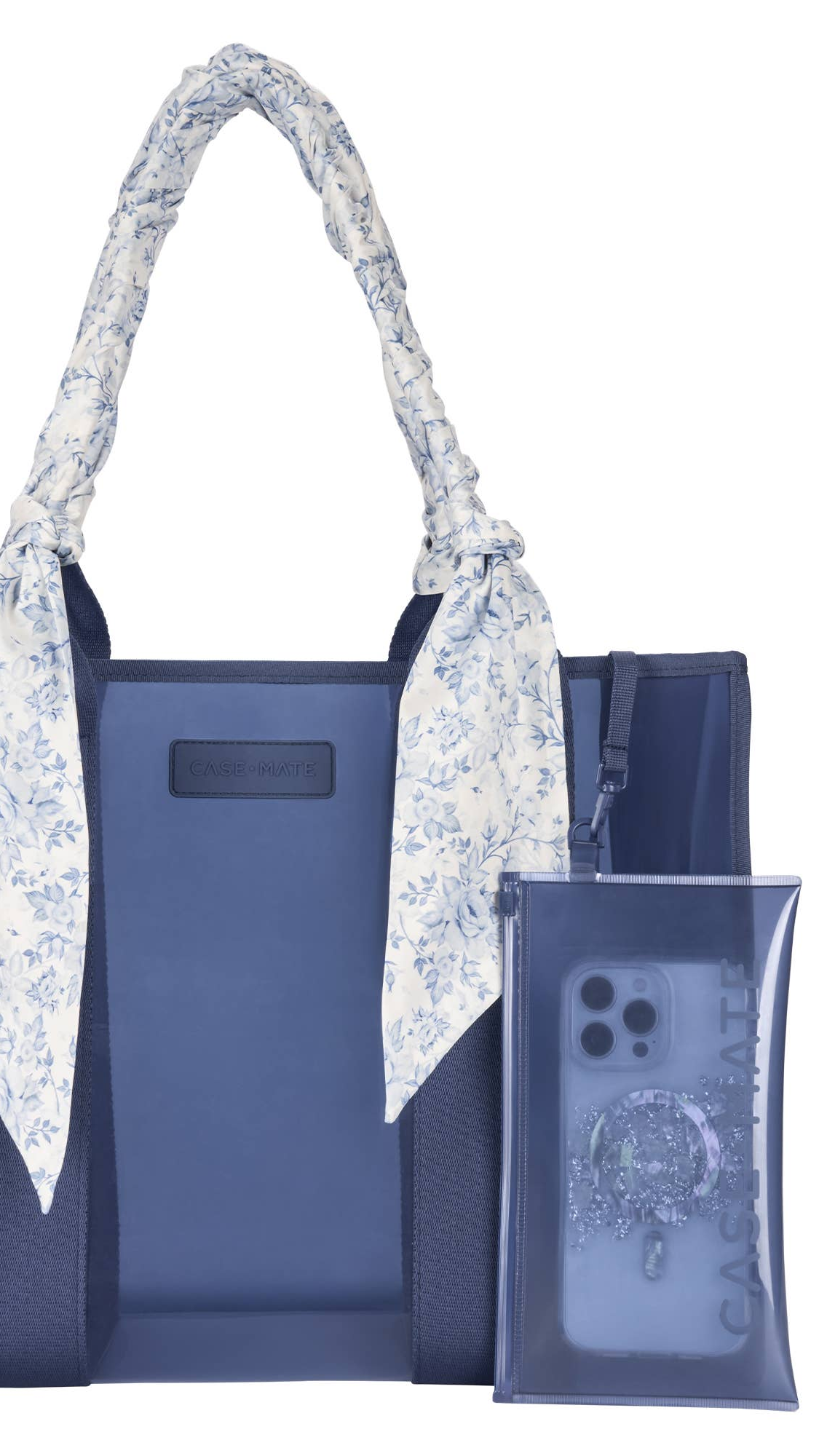 Blue tote bag with floral handle and matching phone case on a white background