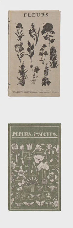 Four decorative books with floral and nature-themed covers on a white background