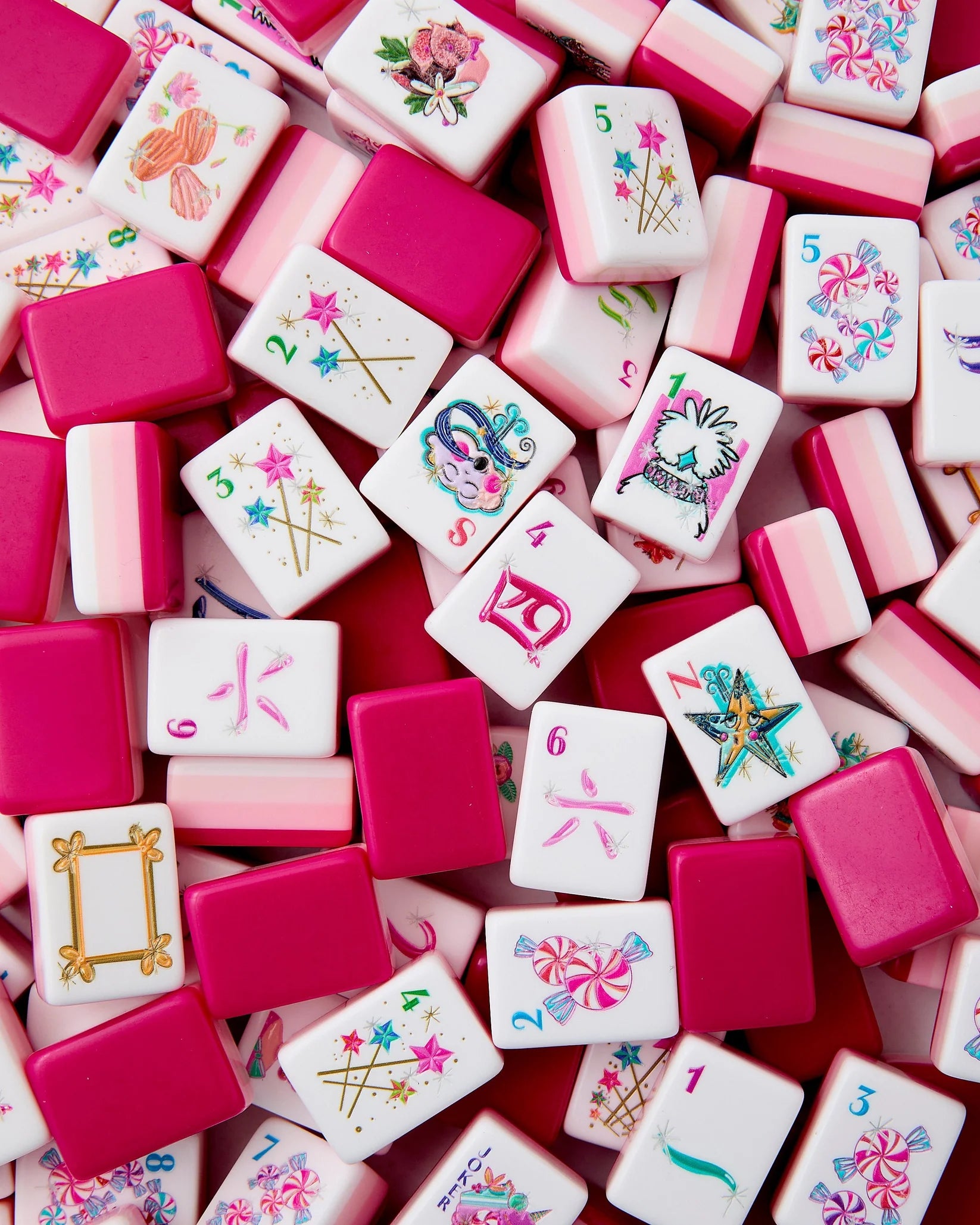 Colorful mahjong tiles with various designs on a red background