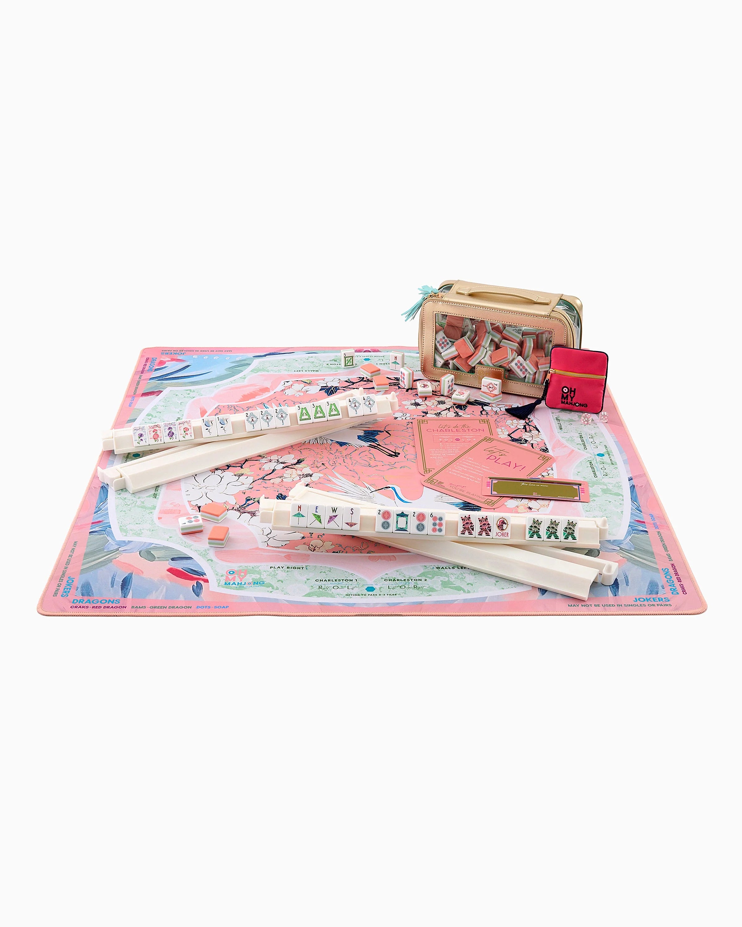Children's toy set with colorful mat, wooden blocks, and other items on a white background
