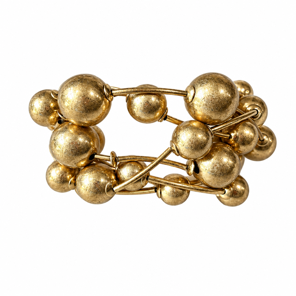 Gold six-strand bracelet alone on solid white, no display pillow