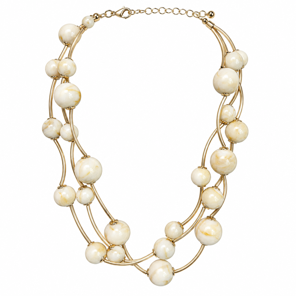 Cream multi-strand necklace alone on solid white