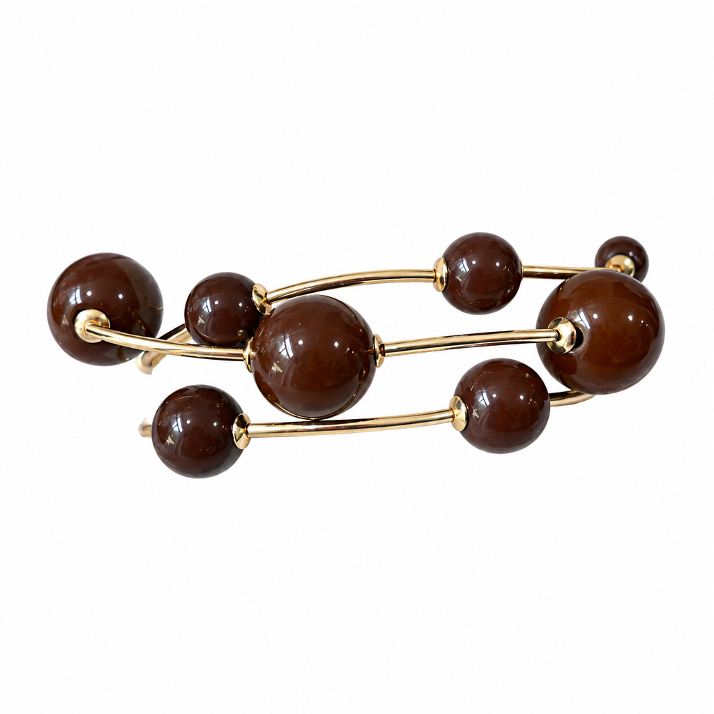 Brown three-strand bracelet on solid white