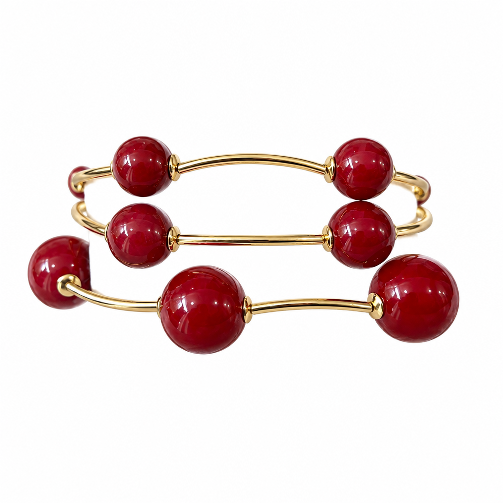 Red three-strand bracelet on solid white