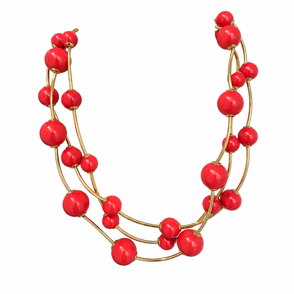Red multi-strand necklace alone on solid white, first view