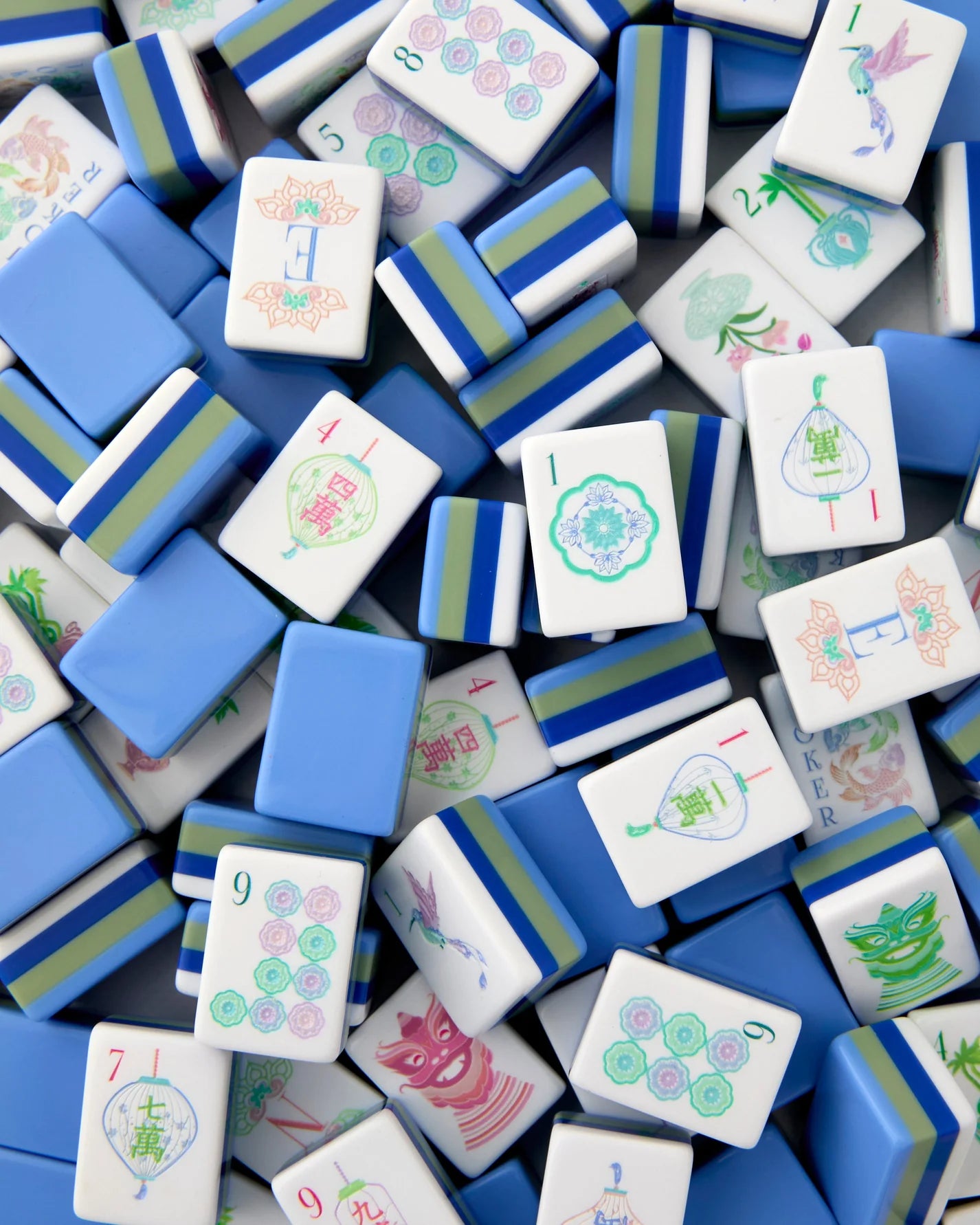 Collection of colorful麻将 tiles with various designs on a blue background