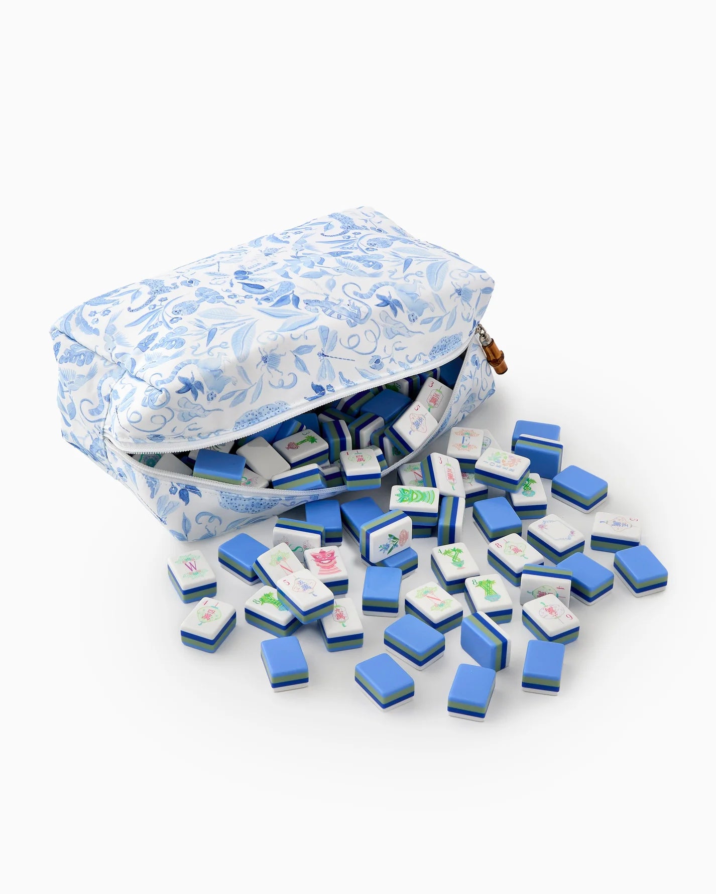 Blue and white mini travel mahjong set with patterned bag on a white background