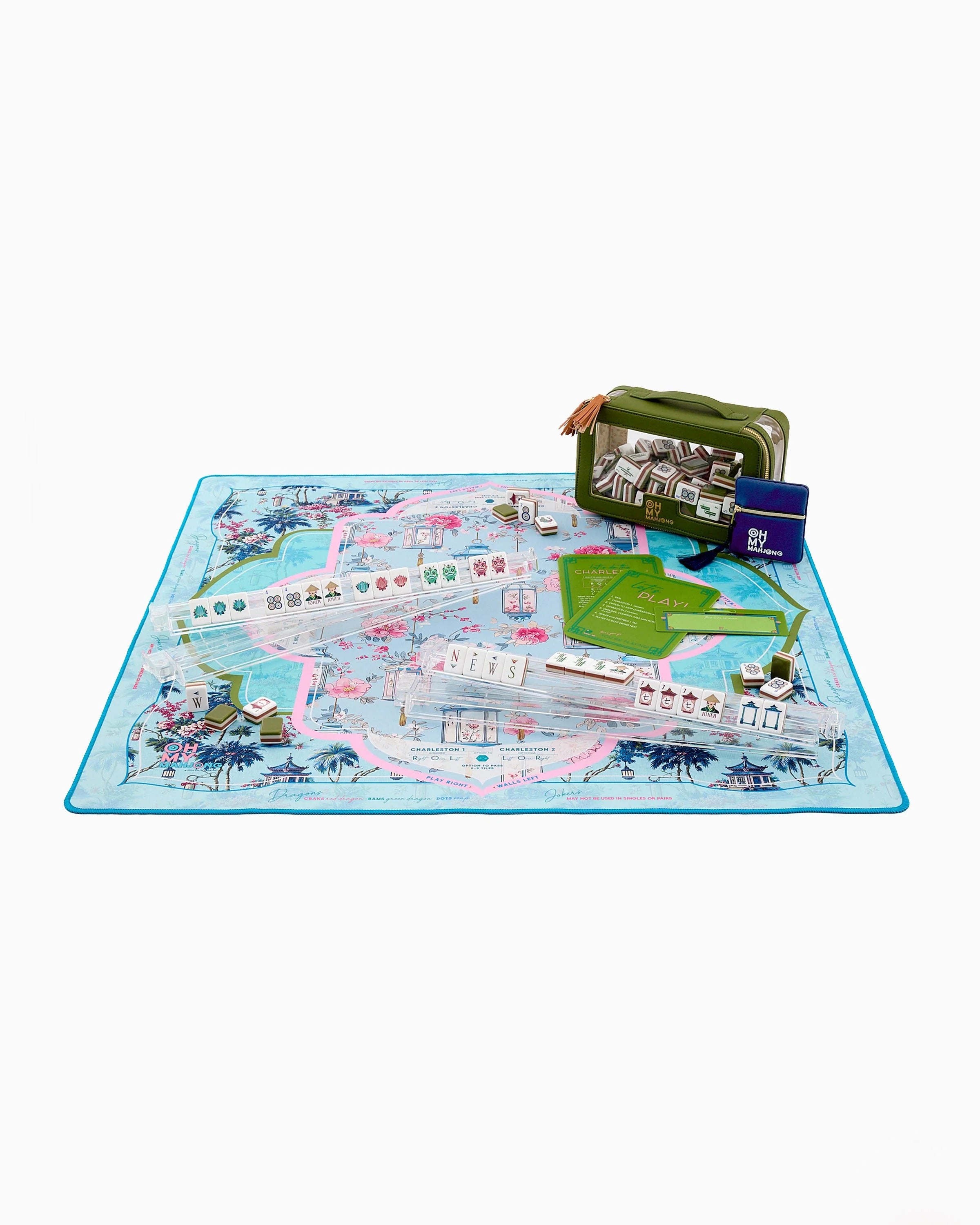 Board game set with pieces and a map on a blue play mat.