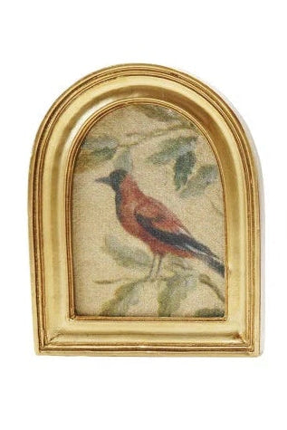Collection of gold-framed pictures with various scenes on a white background