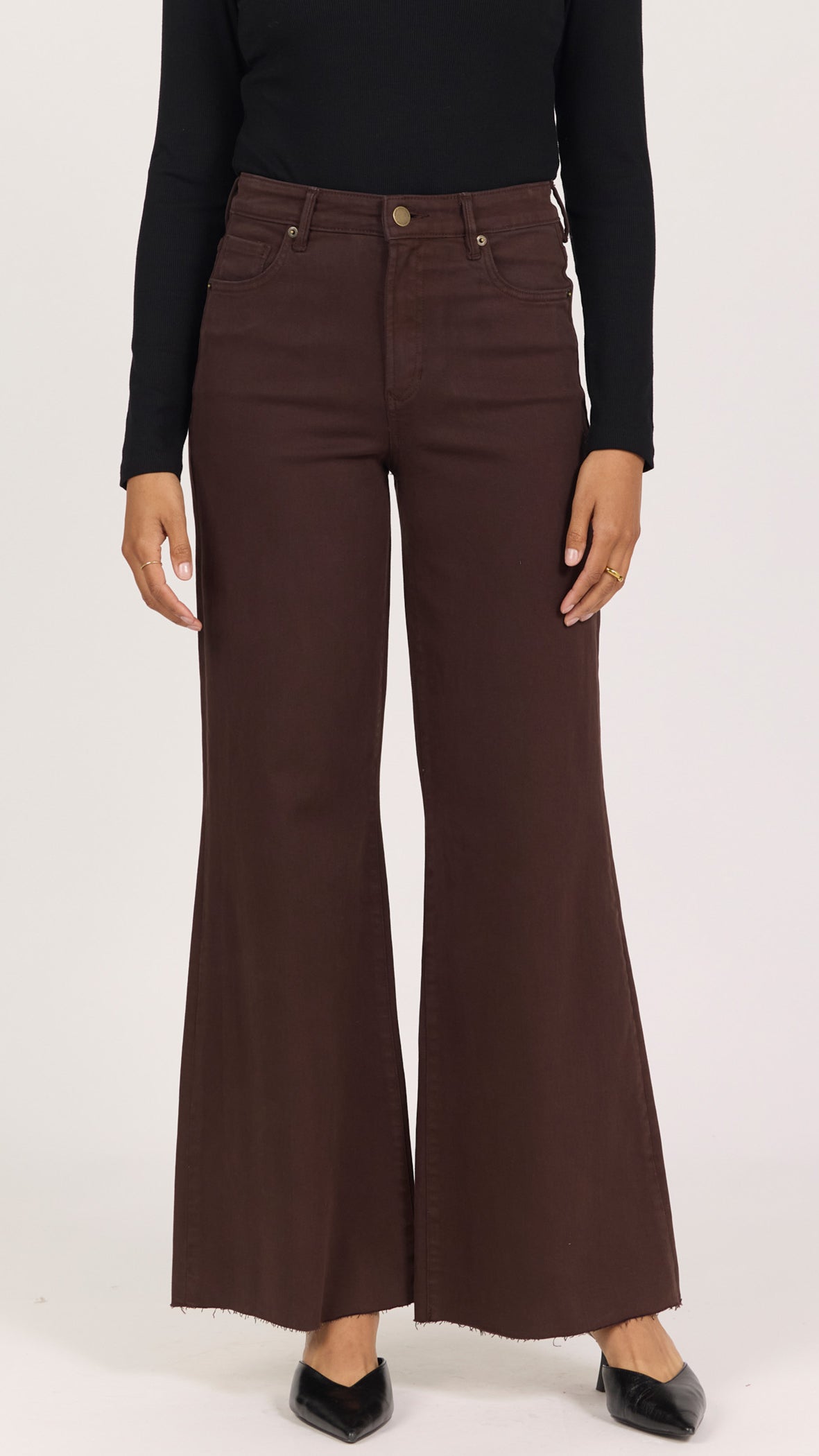 Front view of dark oak brown Fiona jeans showing the high rise, button closure and raw cut hem