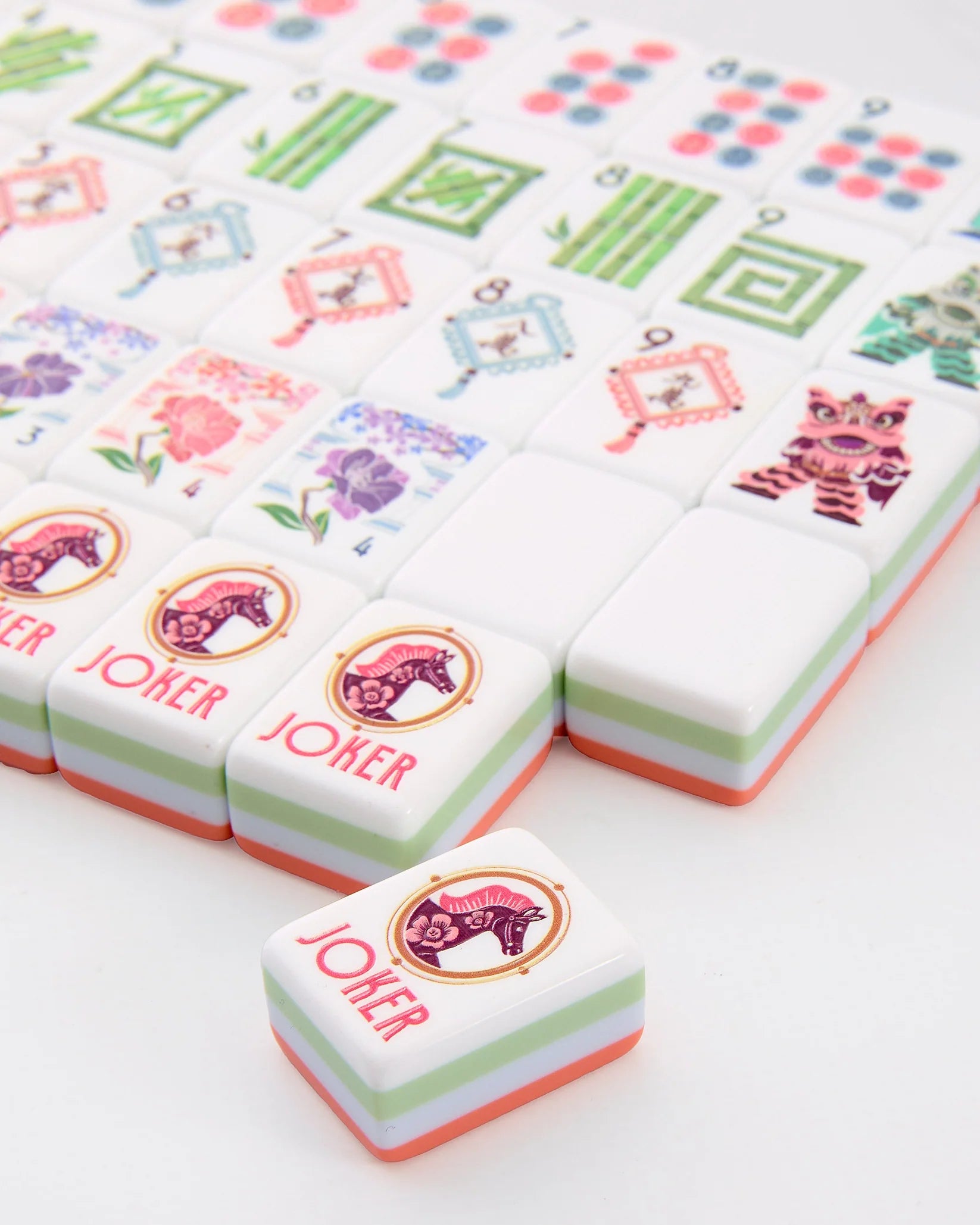 Colorful game pieces with 'Joker' text on a white background